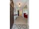 Bright entryway with light wood floors, decorative light fixture, and open floor plan at 1503 Clairdale Ln, Lakeland, FL 33801