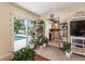 Open living room with sliding glass doors leading to a private pool at 1503 Clairdale Ln, Lakeland, FL 33801