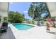 Backyard oasis with sparkling pool, lush landscaping and patio seating at 1503 Clairdale Ln, Lakeland, FL 33801