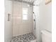Shower with a window, and a unique hexagonal tile design at 1503 Clairdale Ln, Lakeland, FL 33801