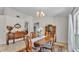 Traditional dining room featuring a wood table, ornate cabinet, and decorative buffet, creating a warm, inviting space at 1920 Farrington Dr, Lakeland, FL 33809