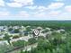 Aerial view of a peaceful neighborhood with lush greenery, showcasing the home's prime location at 3300 Hawks Ridge Dr, Lakeland, FL 33810