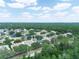 Aerial view showcasing a neighborhood surrounded by lush greenery and trees at 3300 Hawks Ridge Dr, Lakeland, FL 33810