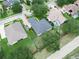Aerial view of property with well-manicured lawn and mature trees at 3300 Hawks Ridge Dr, Lakeland, FL 33810