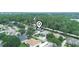 Aerial view of a peaceful neighborhood with lush greenery, showcasing the home's prime location at 3300 Hawks Ridge Dr, Lakeland, FL 33810