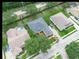 Aerial view showcasing a well-maintained neighborhood with mature trees and green lawns at 3300 Hawks Ridge Dr, Lakeland, FL 33810