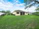 Spacious backyard with lush lawn and a screened in patio at 3300 Hawks Ridge Dr, Lakeland, FL 33810
