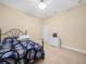 Comfortable bedroom with neutral carpet, a ceiling fan, and a decorative bedspread at 3300 Hawks Ridge Dr, Lakeland, FL 33810
