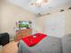 Comfortable bedroom featuring a dresser, flat screen tv, and a closet for convenient storage at 3300 Hawks Ridge Dr, Lakeland, FL 33810