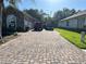 Paver driveway leads to the attached garage and offers ample parking space at 3300 Hawks Ridge Dr, Lakeland, FL 33810