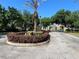 Gated community entrance features a manicured landscape and a stately stone sign at 3300 Hawks Ridge Dr, Lakeland, FL 33810