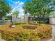 Landscaped entry to Hawks Ridge gated community with stone pillars, wrought iron gates, and lush foliage at 3300 Hawks Ridge Dr, Lakeland, FL 33810