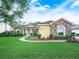 Charming stone-accented home featuring a well-manicured lawn, curved walkway, and bright, inviting facade at 3300 Hawks Ridge Dr, Lakeland, FL 33810