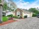 Charming home featuring a stone accent wall and a two-car garage at 3300 Hawks Ridge Dr, Lakeland, FL 33810