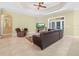 Cozy living room with comfortable seating, a ceiling fan, and backyard access at 3300 Hawks Ridge Dr, Lakeland, FL 33810