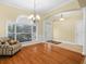 Cozy living room with hardwood floors, a large window, and ample natural light at 3300 Hawks Ridge Dr, Lakeland, FL 33810