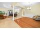 Open-concept floor plan with hardwood and tile flooring throughout the living area at 3300 Hawks Ridge Dr, Lakeland, FL 33810