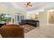 Open-concept living area with tile flooring and a comfortable seating arrangement at 3300 Hawks Ridge Dr, Lakeland, FL 33810