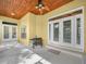 Covered patio featuring a ceiling fan, grill, and doors leading into the home at 3300 Hawks Ridge Dr, Lakeland, FL 33810