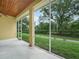 Screened patio offering views of the landscaped backyard at 3300 Hawks Ridge Dr, Lakeland, FL 33810