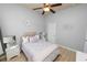 Comfortable bedroom featuring a ceiling fan, window, and neutral color palette at 1167 Stoney Creek Blvd, Lakeland, FL 33811