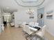 Modern dining room with a chandelier, neutral color palette, and a contemporary table setting at 1167 Stoney Creek Blvd, Lakeland, FL 33811