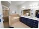 This main bathroom features double sinks, an enclosed glass shower and soaking tub at 1167 Stoney Creek Blvd, Lakeland, FL 33811
