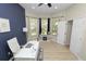Bright home office with large windows, neutral paint, and modern desk setup at 1167 Stoney Creek Blvd, Lakeland, FL 33811