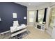 Bright home office with large windows, a decorative rug, and modern desk setup at 1167 Stoney Creek Blvd, Lakeland, FL 33811