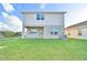 Backyard of home showing lawn, patio, and exterior at 2303 Brassie Ct, Winter Haven, FL 33884