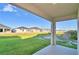 Backyard patio overlooking lawn at 2303 Brassie Ct, Winter Haven, FL 33884