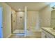 Bathroom featuring a glass shower, separate tub, and sink with a granite countertop at 2303 Brassie Ct, Winter Haven, FL 33884