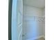 A closet with a door and shelves at 2303 Brassie Ct, Winter Haven, FL 33884