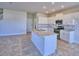 Modern kitchen with granite countertops, stainless steel appliances, and a center island at 2303 Brassie Ct, Winter Haven, FL 33884