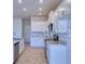 Well-equipped kitchen features stainless steel appliances, sleek countertops, and ample cabinetry at 2303 Brassie Ct, Winter Haven, FL 33884
