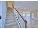 Carpeted staircase leading to the upper level at 2303 Brassie Ct, Winter Haven, FL 33884
