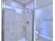 Bathroom featuring glass enclosed shower with tile surround and fixtures at 2307 Brassie Ct, Winter Haven, FL 33884