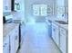 Spacious kitchen with white cabinets and stainless steel appliances at 2307 Brassie Ct, Winter Haven, FL 33884