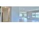 Spacious living room features tile floors and bright windows at 2307 Brassie Ct, Winter Haven, FL 33884