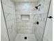 Modern shower with white and gray marble tile and matte black fixtures at 2527 Dons Pl, Lakeland, FL 33801
