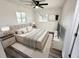 Comfortable bedroom with modern furniture, stylish decor, and hardwood floors at 2527 Dons Pl, Lakeland, FL 33801