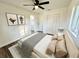 Cozy bedroom featuring neutral decor, closet, ceiling fan and ensuite bathroom at 2527 Dons Pl, Lakeland, FL 33801