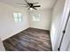 Clean, simple bedroom featuring wood floors, and neutral paint at 2527 Dons Pl, Lakeland, FL 33801