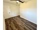 Bedroom featuring laminate floors, a ceiling fan, closet, and bright, neutral paint at 2527 Dons Pl, Lakeland, FL 33801