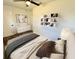 Well-lit bedroom featuring wood floors, ceiling fan and decorative shelving at 2527 Dons Pl, Lakeland, FL 33801