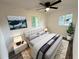 Bright bedroom featuring a ceiling fan, neutral walls, and luxury vinyl plank flooring at 2527 Dons Pl, Lakeland, FL 33801