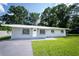 Charming single-story home with a well-maintained lawn and freshly painted exterior at 2527 Dons Pl, Lakeland, FL 33801