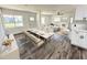 Bright living room with dining area featuring modern furniture, fixtures and wood floors at 2527 Dons Pl, Lakeland, FL 33801