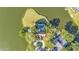Aerial view of a waterfront home with a pool and lush landscaping at 3906 Canyon Lake Pt, Lakeland, FL 33813