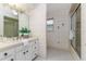 Bathroom with floral wallpaper, neutral flooring, a large shower, and a vanity at 3906 Canyon Lake Pt, Lakeland, FL 33813